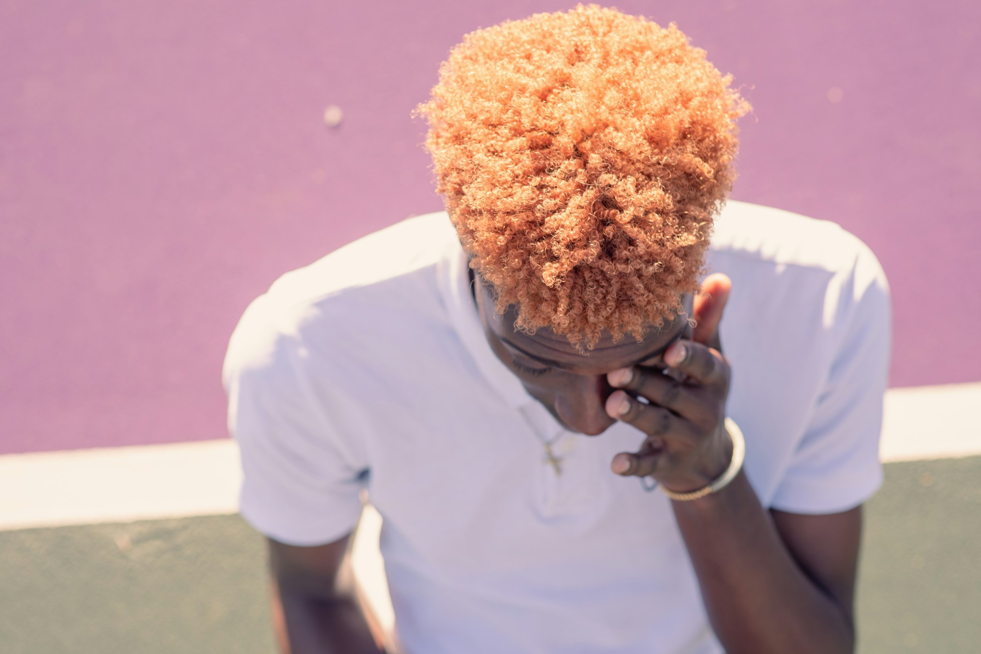 Close up portrait of young man with brightly colored hair