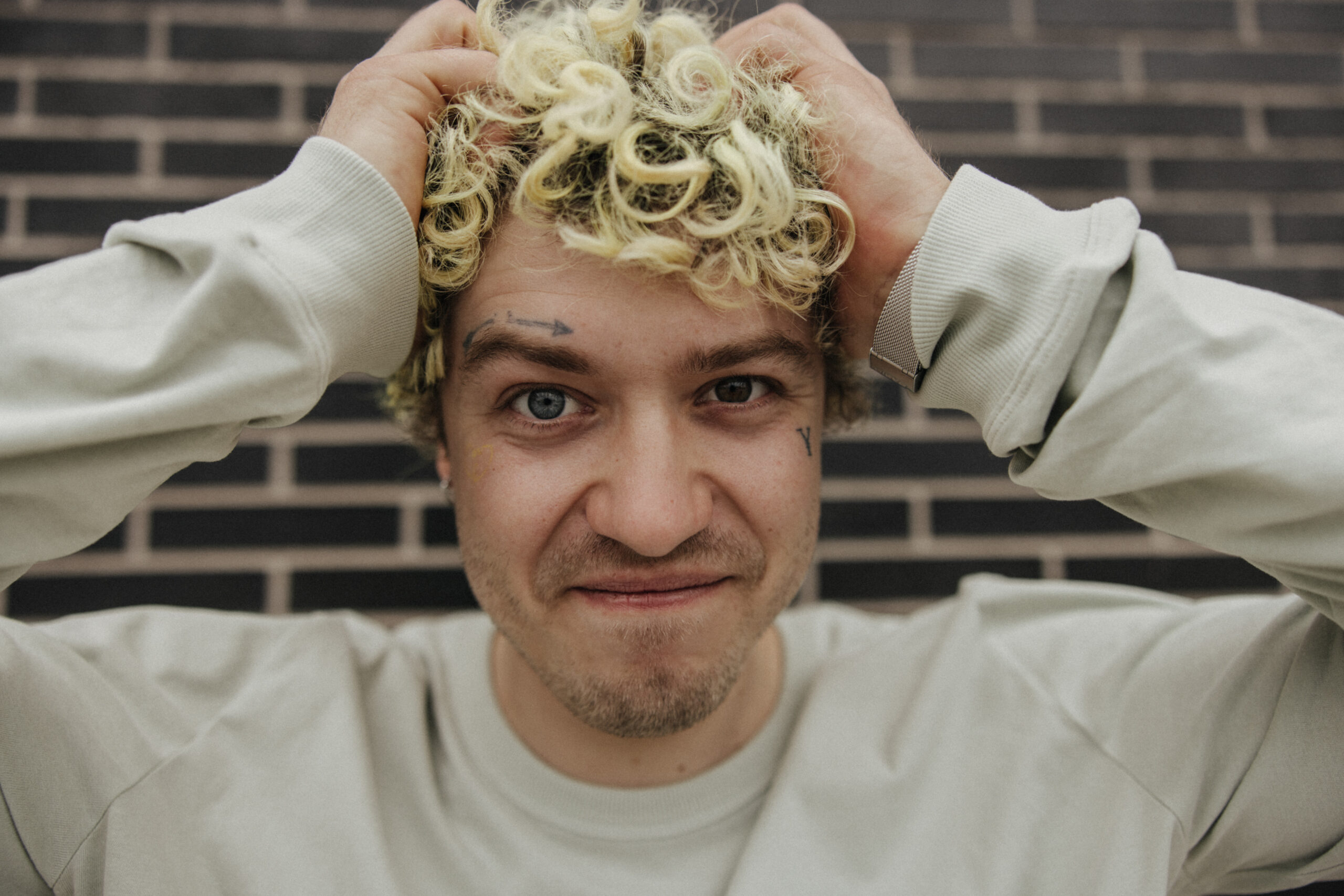 image-positive-curly-hair-man-smile-camera